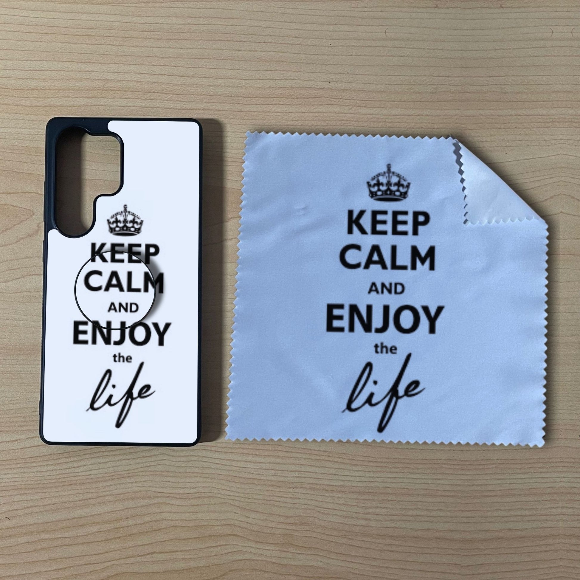 Custom Samsung case bundle set with matching phone grip and cleaning microfiber cloth with "Keep calm and enjoy the life" text design on a wooden surface