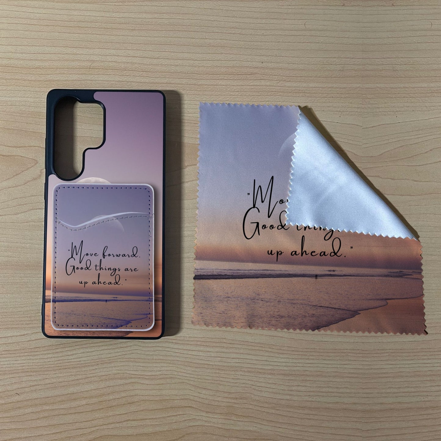 Custom Samsung case with a beach design with matching phone wallet card holder and matching microfiber cloth phone screen cleaner on a wooden surface