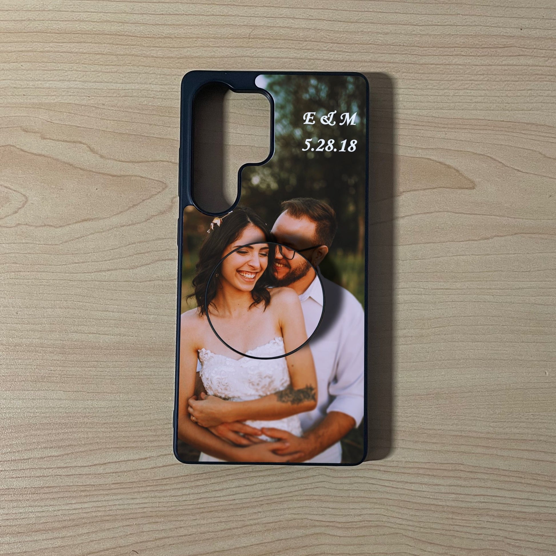Custom Samsung phone case with a photo of a couple on a wooden surface