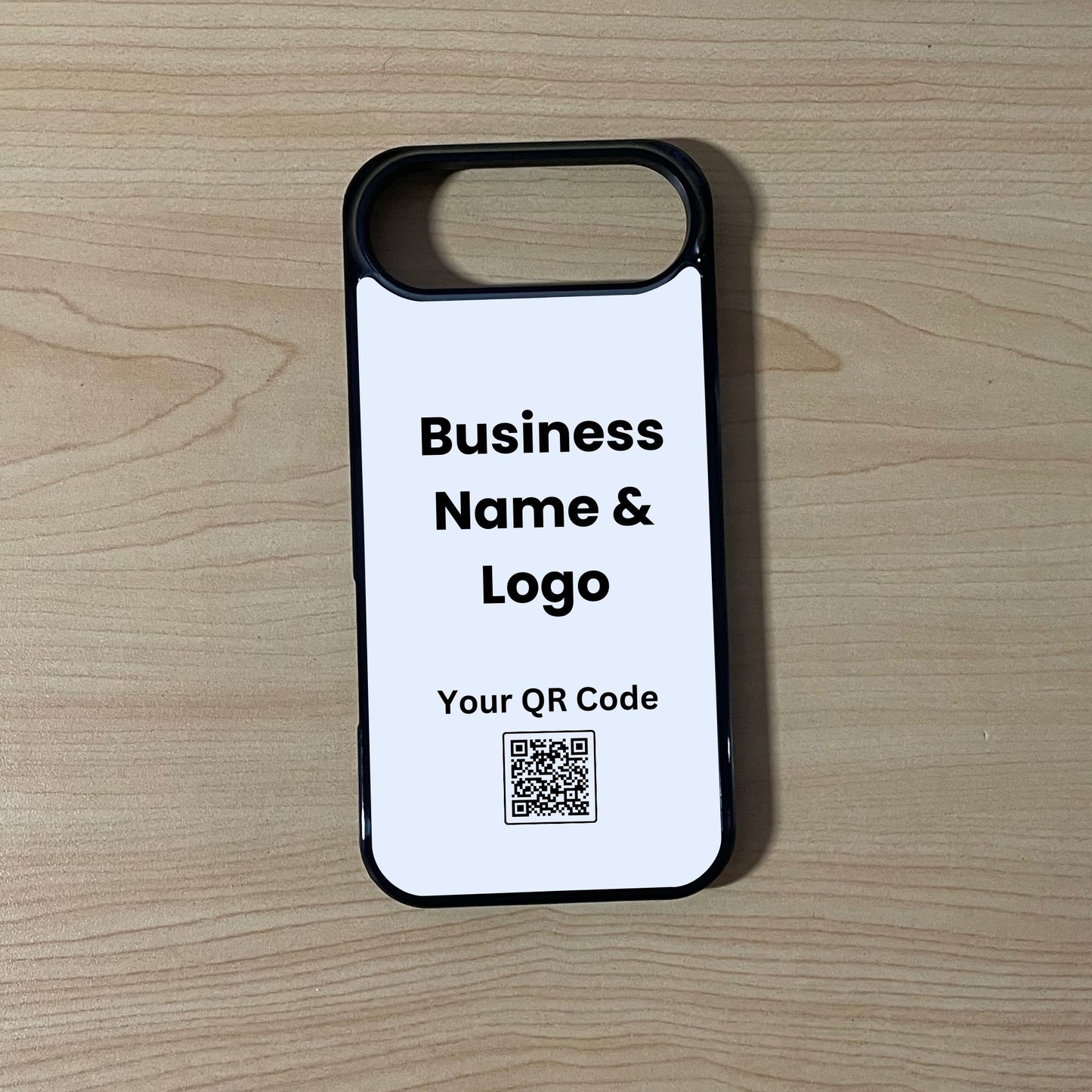 Custom phone case for the iPhone 17 Air showing qr code and business logo placement on a wooden surface.