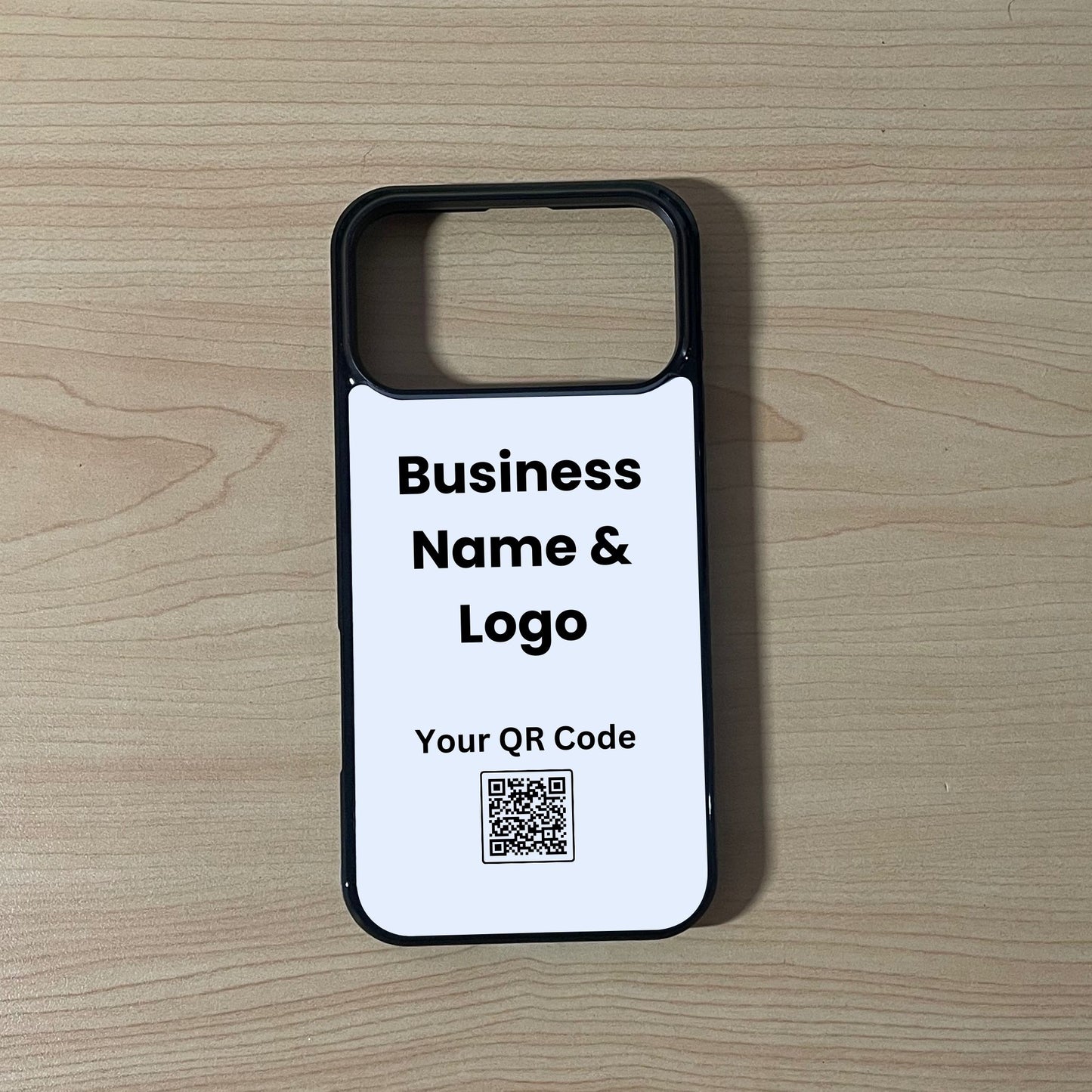 Custom phone case for the iPhone 17 Pro and 17 Pro Max showing qr code and business logo  placement on a wooden surface.