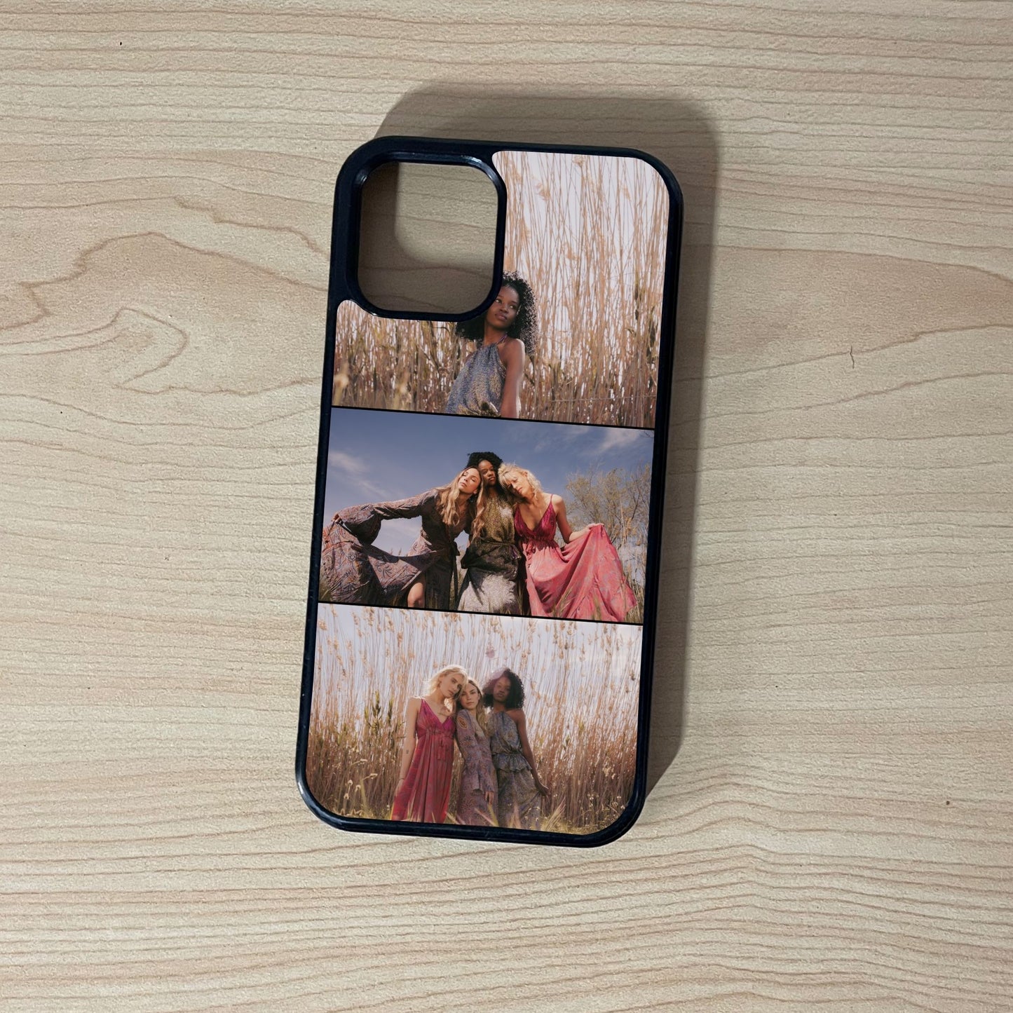 Phone case with collage of people in a field on a wooden surface