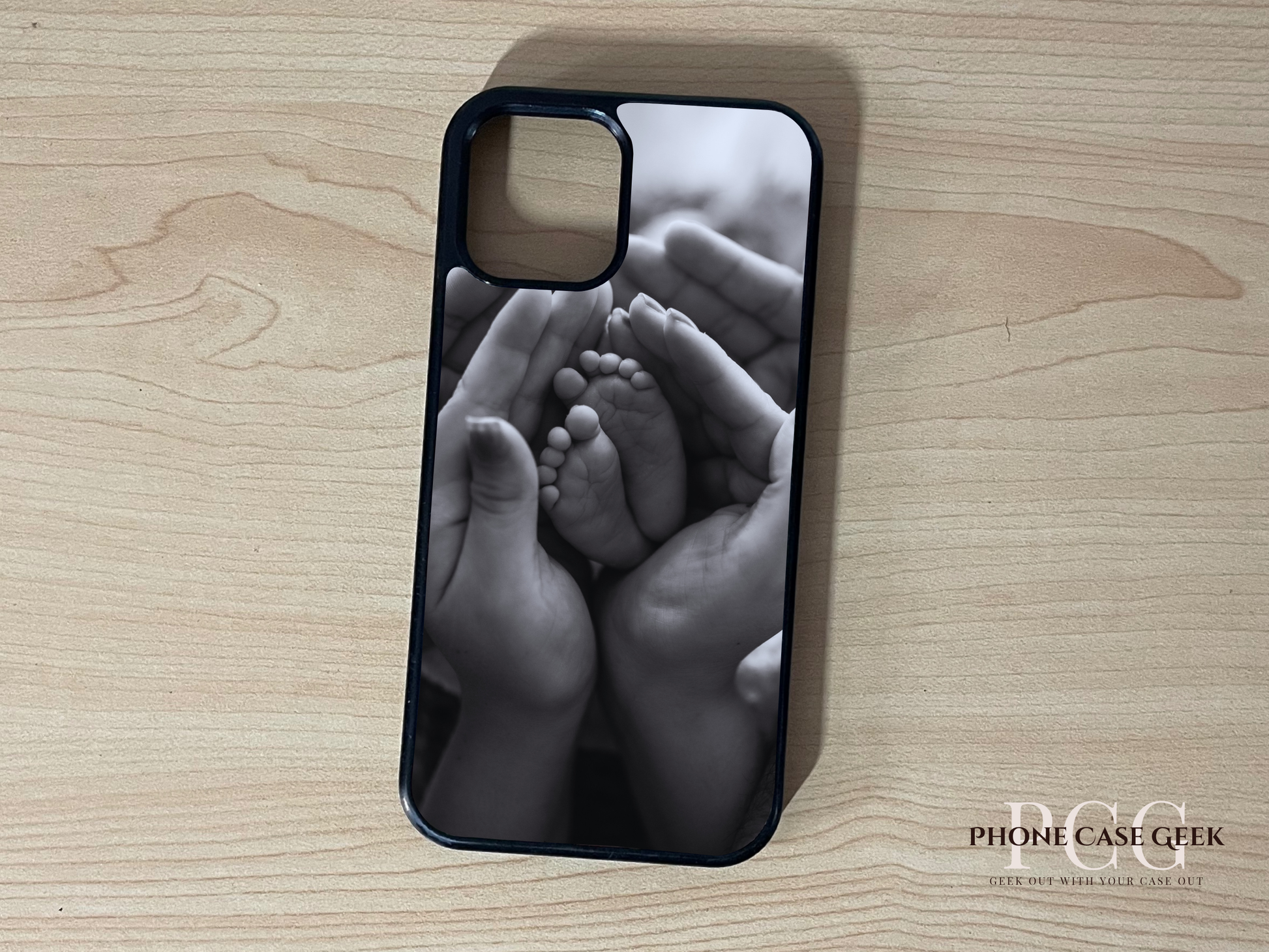 Custom iPhone case of photo of with hands holding baby feet design on a wooden surface