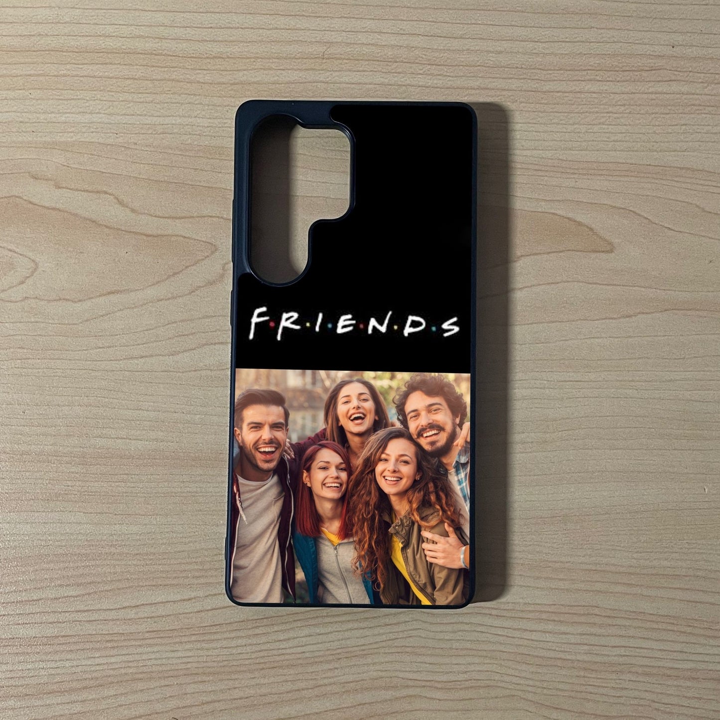 Custom phone case for the Samsung S series with 2 photo collage with 'Friends' text and a group photo on a wooden surface.