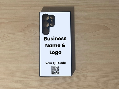 Custom phone case for the Samsung  S24 Ultra, S23 Ultra and S22 Ultra showing  placement for business logo design and customizable QR code on a wooden surface
