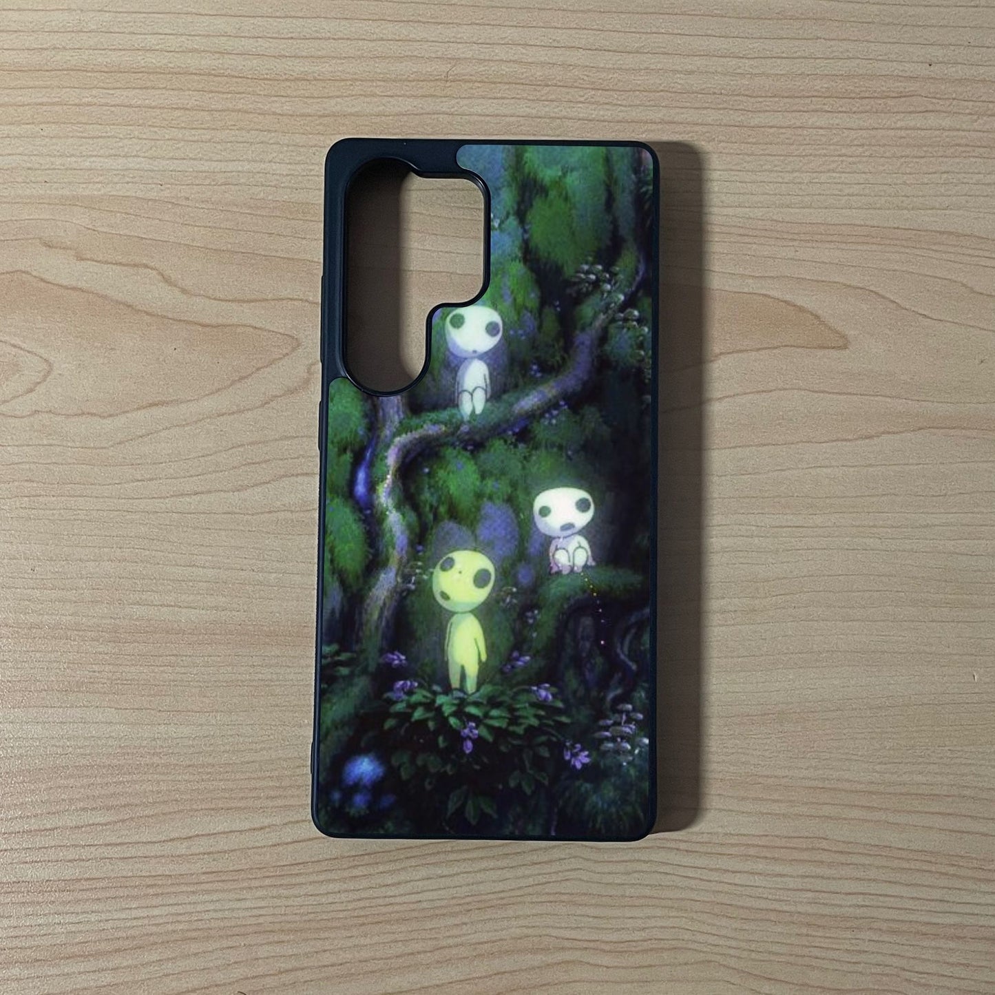 Samsung S25 Ultra custom iPhone case with an image of a beautiful forest with  forest spirit characters on a wooden surface.